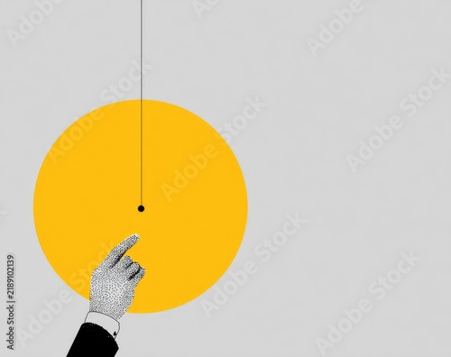 A grayscale hand points to a central point on a large yellow circle