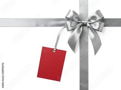 Silver ribbon bow with a blank red gift tag
