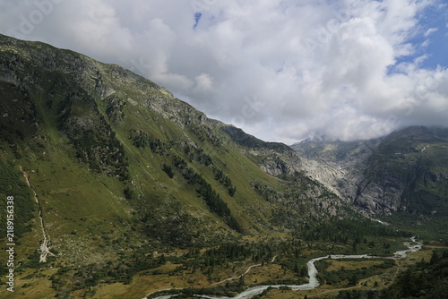 Bild auf Leinwand View of the Rhone Valley with the River Rhone in the Swiss Alps