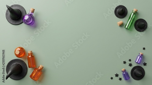 Top view of festive halloween decorations including witch hats and colorful potion bottles arranged on a light green background surface