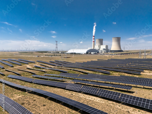 Obraz na płótnie solar panels and thermal power plant in field