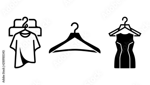 Clothing hangers, including at-shirt on hanger, an empty hanger, dress on hanger on