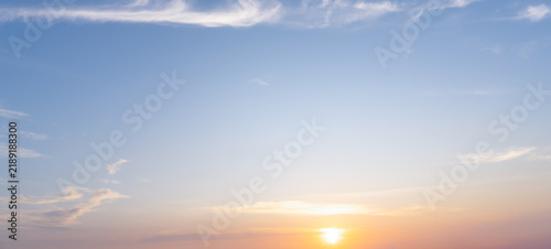 Beautiful morning or evening blue and orange sky with cloudy while sunsets or sunrises taken at the sea used as natural background texture