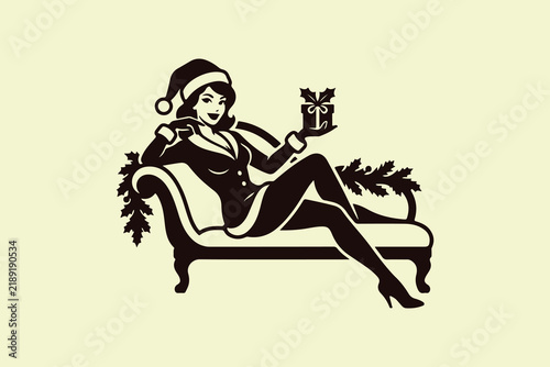 Woman Dressed as Santa Holding a Gift Box, Sitting on a Sofa – Elegant Christmas Illustration Adobe Illustrator Artwork