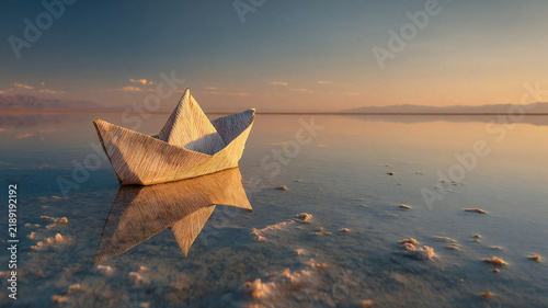 Paper boat floating on a mirror-like salt flat at sunset. Generated by AI.