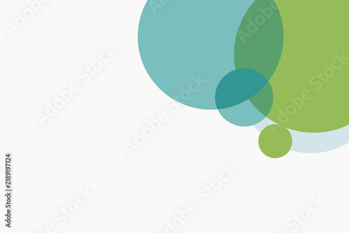 Overlapping translucent circles in green teal and pale blue in one corner
