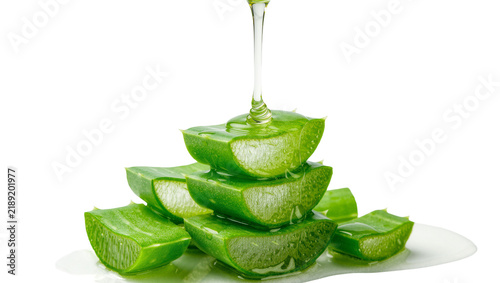 Stack of fresh aloe vera slices with clear gel dripping, isolated on transparent background