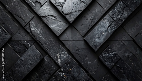 Dark angular stone arrangement creates a bold geometric pattern with textured surfaces and varying shades of gray and black