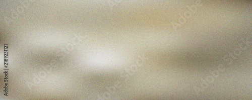 Abstract soft warm golden light gradient surface with subtle grainy texture for creative digital projects