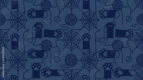 Seamless dark blue pattern of cat paws, yarn, and spiderwebs