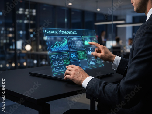 Business executive managing digital files using advanced augmented reality interface in modern office environment while working late during night shift hours.