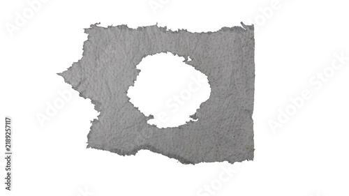 Lightweight paper, torn and tattered with a hole in the center, isolated on a transparent background.