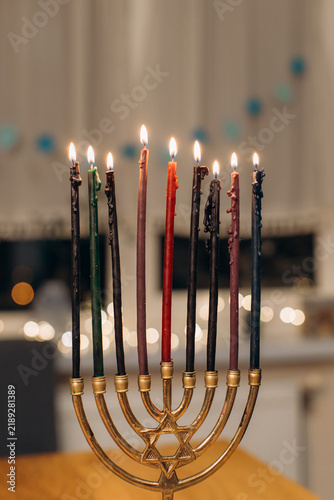 Fotografie Hanukkah celebration with lit menorah candles