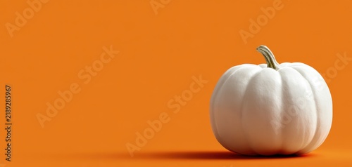 White pumpkin on orange Halloween copy space