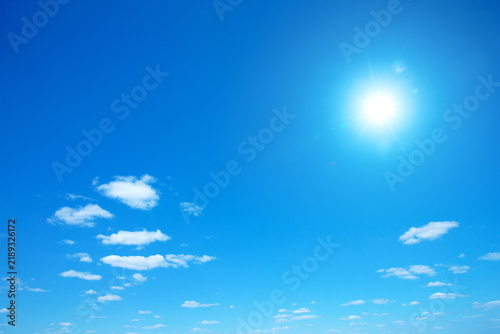 Sun shining in blue sky. Sunny background. Blue sky background.