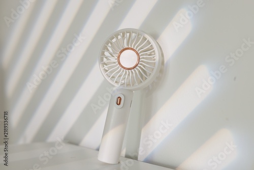 Mini fan on white table indoors, closeup
