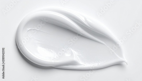 White cosmetic cream swirl isolated on white background, luxury skincare texture, minimal beauty product concept