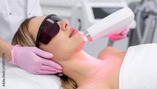 IPL hair removal device emitting light for smooth skin, advanced beauty treatment technology