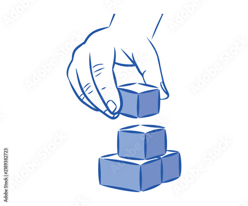 Hand building a structure with blue blocks representing strategy planning development and creative problem solving skills