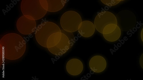 Seamless Animation of Soft Glowing Particles Slowly Flying against a Dark Dackground