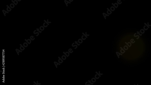 Seamless Animation of Soft Glowing Particles Slowly Flying against a Dark Dackground