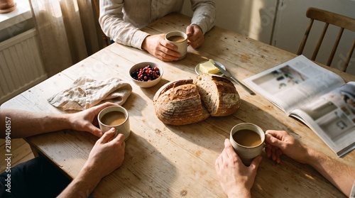 Two people drinking coffee home