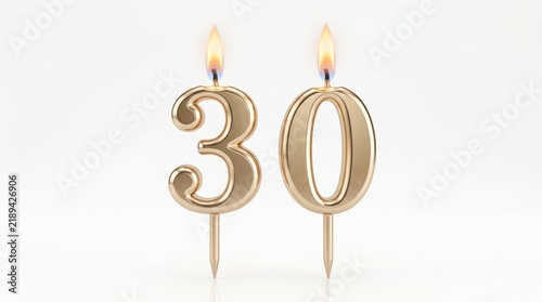 Gold number 30 birthday candles with burning flames. Metallic golden thirtieth anniversary celebration candles. Elegant 30th birthday cake toppers on white background.