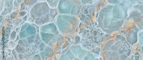 Blue agate crystal texture with turquoise cellular formations and gold veins forming an exotic luxury natural stone background