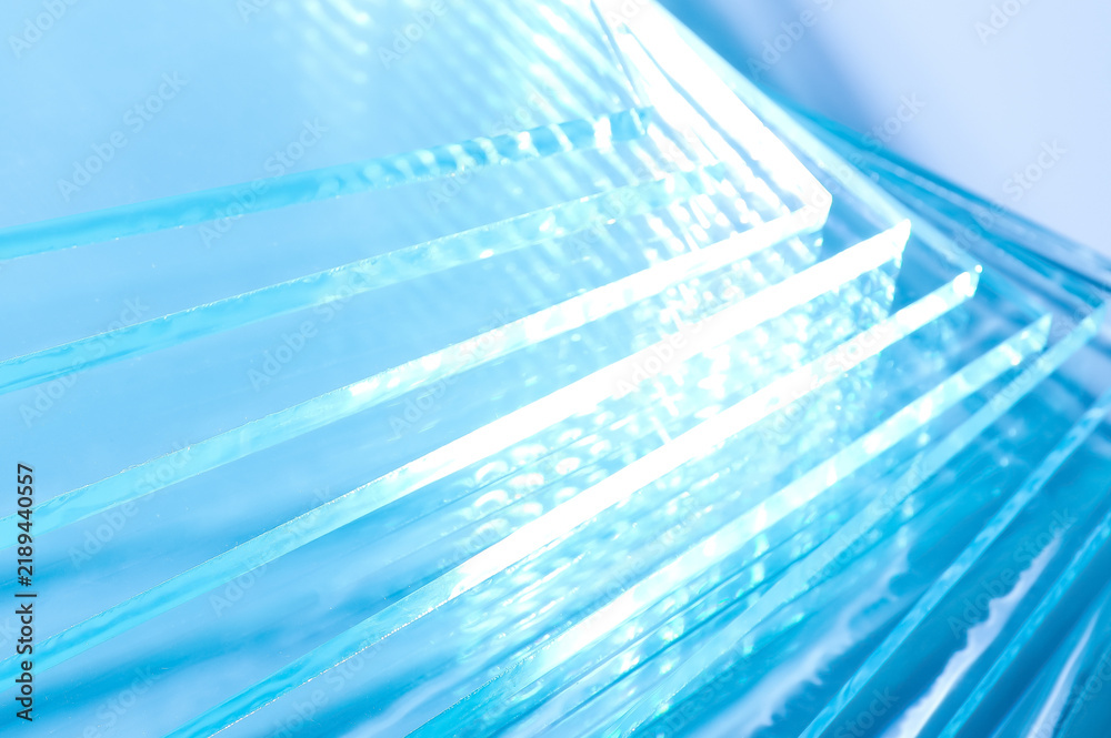 Obraz premium Closeup view of many stacked glass sheets