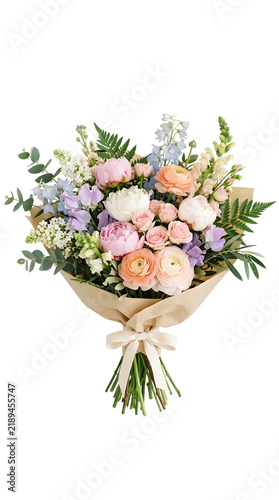 Delicate pastel bouquet wrapped in brown paper tied with bow