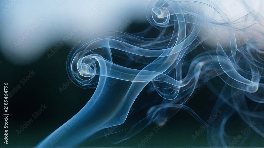 Fototapeta premium Blue Smoke Swirls On Dark Background.