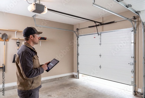 Service worker using tablet for garage door system diagnostics