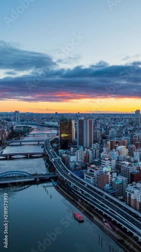  Vertical video, 4k Time lapse Aerial view of Tokyo metropolis and sunrise over the city skyline.