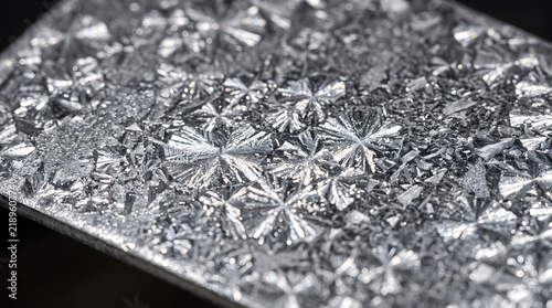 Macro photography of galvanized zinc steel pattern showing crystalline spangle zinc star formations
