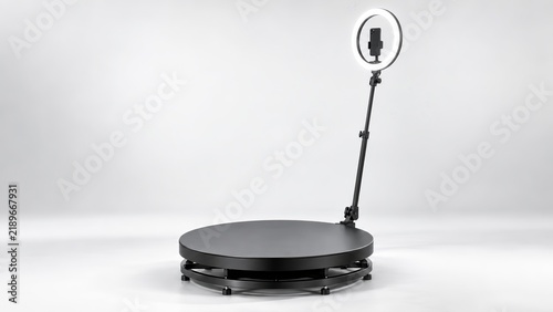 A professional 360 video booth with a rotating platform and ring light.