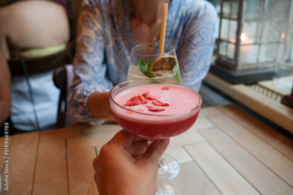 © Studio KME/Stocksy - Friends toasting with colorful drinks at restaurant © Studio KME/Stocksy - Friends toasting with colorful drinks at restaurant