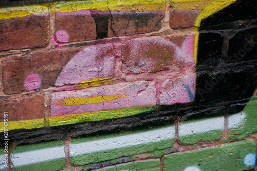 Graffiti - Wolverhampton 2026 - close up - faded details showing layers of previous pieces on the same section of wall.