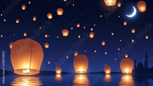 Sky lanterns floating over calm water during night festival celebration
