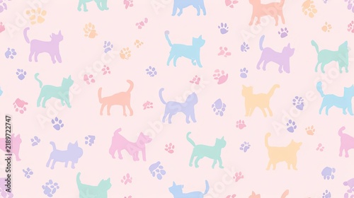 Seamless pastel cat pattern with colorful kittens and tiny paw prints on a soft pink background, cute pet illustration and playful nursery surface design