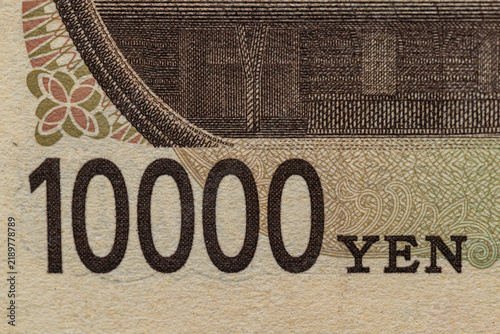 Japanese 10000 yen bill denomination number macro detail close up on reverse side