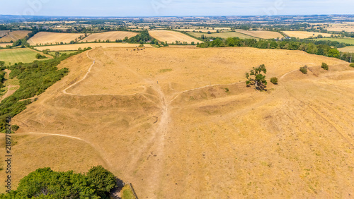 Fotografie An aerial view above the remains of the Burrough Hill Iron Age Hillfort in rural