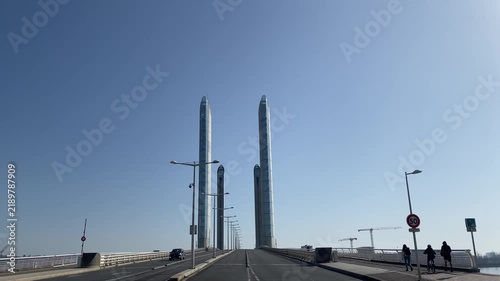 View of the Pont Jacques Chaban-Delmas spanning the Garonne River in Bordeaux, France. The modern lift bridge is a distinctive feature of Bordeaux's waterfront and urban landscape.
