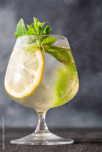 Plakat Refreshing Hugo Spritz cocktail with lemon mint ice bubbles and elegant summer presentation
