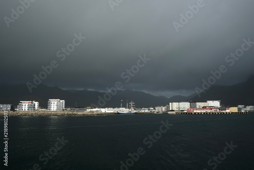 Svolver city distant islands visible under a dramatic sky in Lofoten Islands, Norway during the month of September