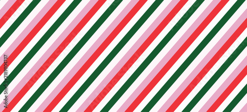 Festive diagonal striped pattern with red green and pink lines on white background