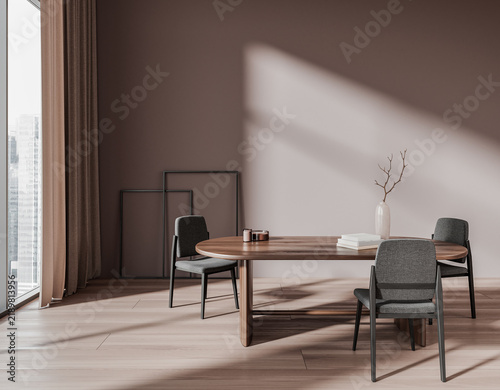 Obraz na plátne Modern dining interior with oval table, upholstered chairs and sunlight on a warm neutral background, expressing comfort and calm