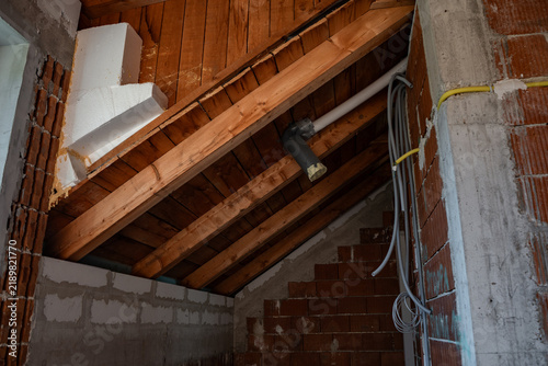 Canvastavla Timber roof construction seen from inside the attic of a new house