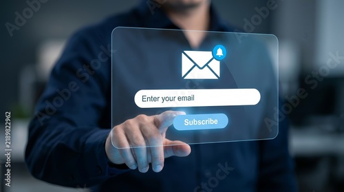 Person using a digital device to complete a newsletter signup form with a subscribe CTA button.