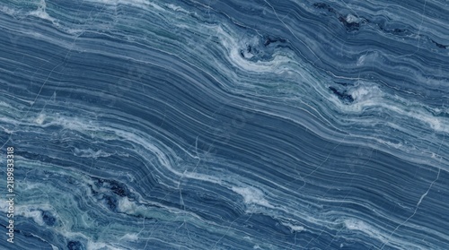 Fotografie Marble Aerial view of a lone boat navigating a vast, textured body of water