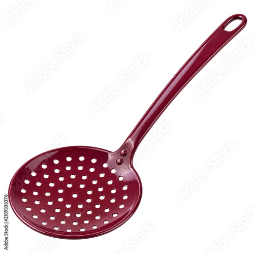 Red enameled metal skimmer for kitchen use, isolated on a white